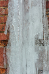 Very large and dangerous icicles in close up