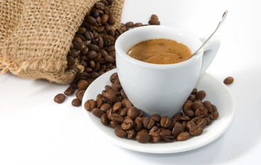 image of cup of coffee and coffee beans closeup