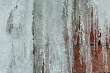 Very large and dangerous icicles in close up