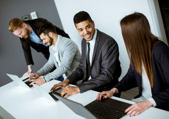 Group of business people sharing their ideas in the office