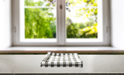 Table background with napkin and window of spring time 