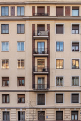 Fototapeta na wymiar Yellow and brown classical facade in Madrid city
