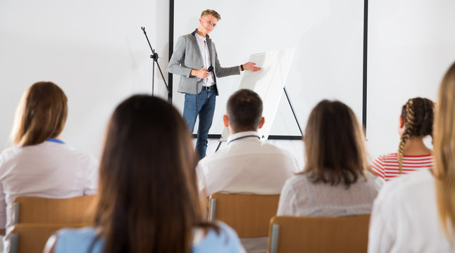 Male coach giving presentation