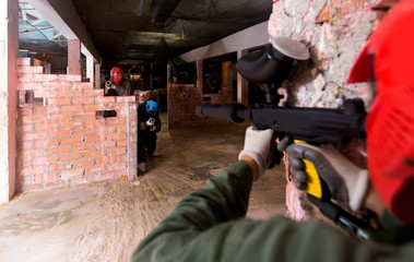 Fototapeta premium Players are targeting in opponents from cover in battlefield.