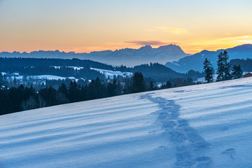 Fototapeta na wymiar sunset in the Bregenzer Wald area of Vorarlberg, Austria with spectacular view on Mount Saentis, Switzerland