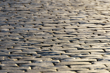 Square pavement illuminated by the sun