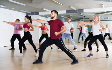 Group of active people practicing together