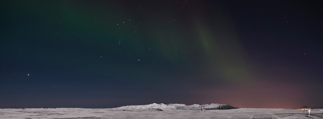 Fototapeta na wymiar Aurora in Night Sky. Iceland. Snow. Night. Light