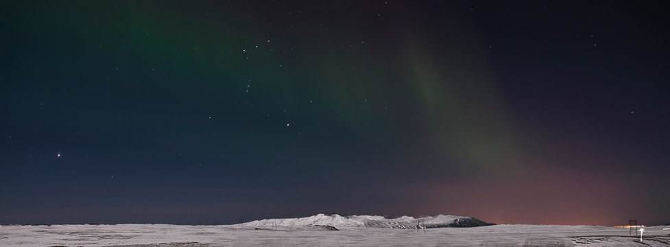 Aurora in Night Sky. Iceland. Snow. Night. Light