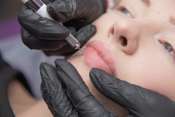 Permanent Makeup For Eyebrows. Microblading brow. Beautician Doing Eyebrow Tattooing For Female...