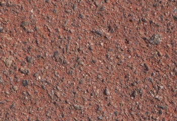 close up of red asphalt pavement
