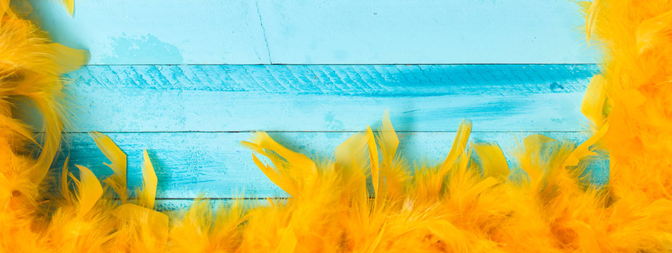 Blue Carnival Background With Yellow Feathers