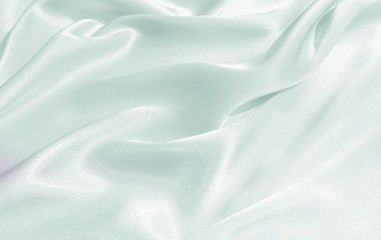 Obraz premium The texture of the satin fabric of blue color for the background