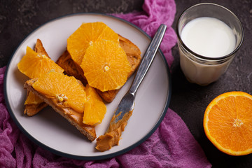 peanut butter toast with orange and milk
