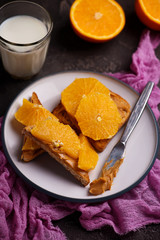 peanut butter toast with orange and milk