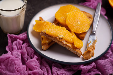 peanut butter toast with orange and milk