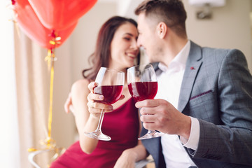 Valentine's Day concept. Happy couple in love with. A young loving couple celebrating Valentine's Day in the restaurant. Lovers give each other gifts. Romance restaurant for Valentine's Day- concept.
