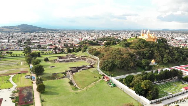 Even today thanks to the old Spanish chapel perched at its summit, the largest man-made pyramid in the world has been mistaken for a hill