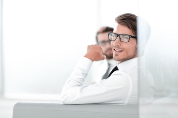 Fototapeta premium serious employees sitting in the office waiting room
