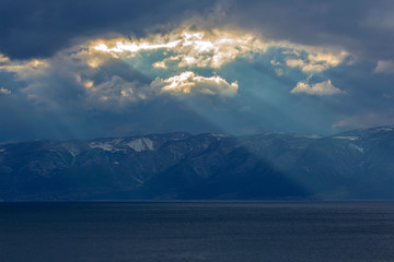 A mystical landscape. The sunset rays that descend over Galichitsa Mountain and Ohrid Lake.