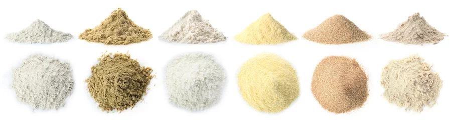 Poster Heap of wheat flour on white background © New Africa
