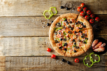 Pizza with shrimp, olives, green pepper and onion