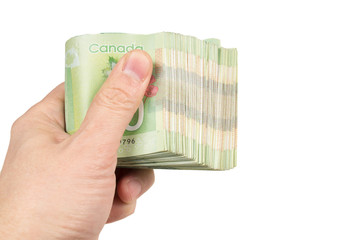 Male hand holding a stacck of green polymer banknotes isolated on white background