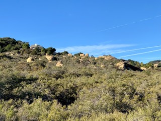 In the mountains of California in the summer. Stones, sand, sun