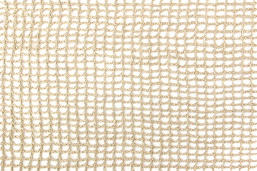 Knitting pattern of linen thread isolated on white background. Handmade linen flax lace material.