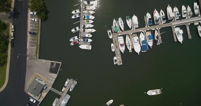 Top Down Aerial Panning of Boats Docked at a Marina