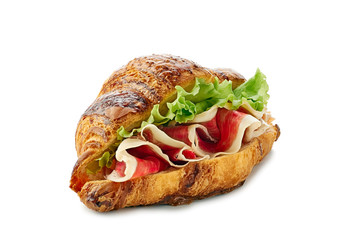 Croissant sandwich with jamon of ham and lettuce on white