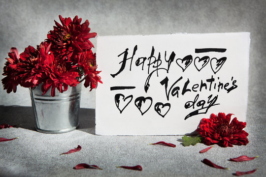 Happy Valentines day card - calligraphy text and red flowers