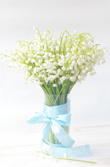 Bouquet of lilies of the valley in a vase. Spring bouquet for your holiday