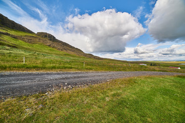 landscape with dirt road and clouds