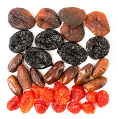 Background of dried apricots, prunes, dogwood and dates.