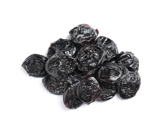 Heap of tasty prunes on white background. Dried fruit as healthy snack