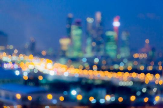 Defocused abstract image. Bokeh effect. Golden lights of the big city. Night city landscape, lights and Windows of houses.