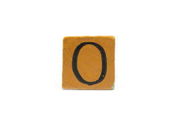 Number zero on cube of wooden material isolated on white background