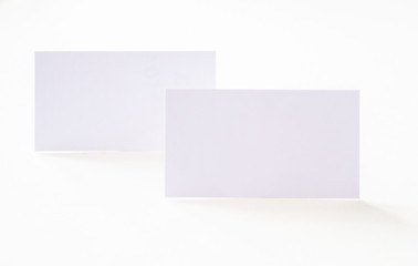 Business cards on the desk top.