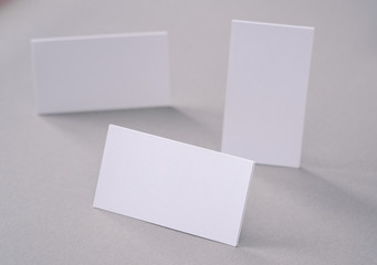 Business cards on the desk top.