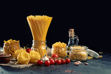 Variety of types and shapes of Italian pasta. Dry pasta background. Italian food concept. Top view