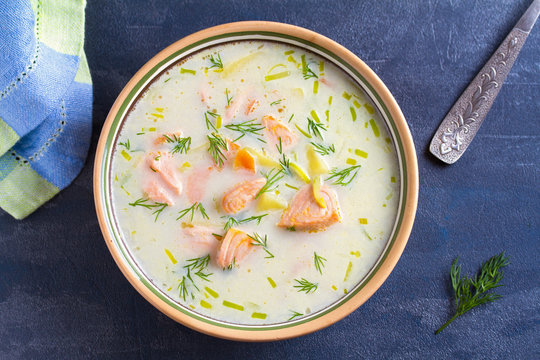 Salmon soup. Creamy hearty salmon fish soup. Clean eating, healthy and diet food concept. View from above, top studio shot