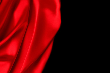 Red silk or satin luxury fabric texture can use as abstract background. Top view