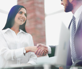 close-up of handshake businessman and business woman.