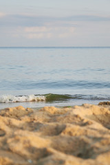 beautiful sandy beach and soft blue sea wave