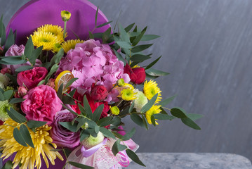 bouqet of flowers in violet box. Nice celebration present. Selective focus, close up