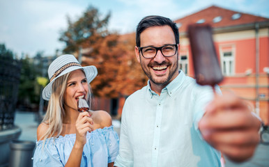 Dating. Young couple eating ice cream. Lifestyle concept