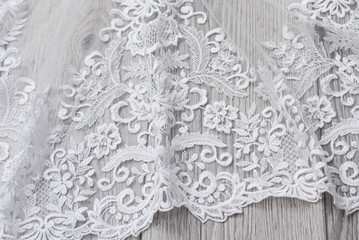 Fototapeta premium The texture of lace on wooden background
