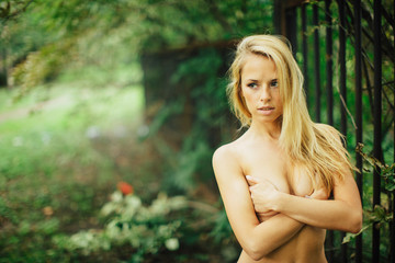 Attractive blond girl posing in the park