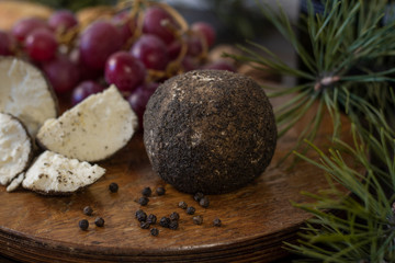 Сheese still life on wooden table